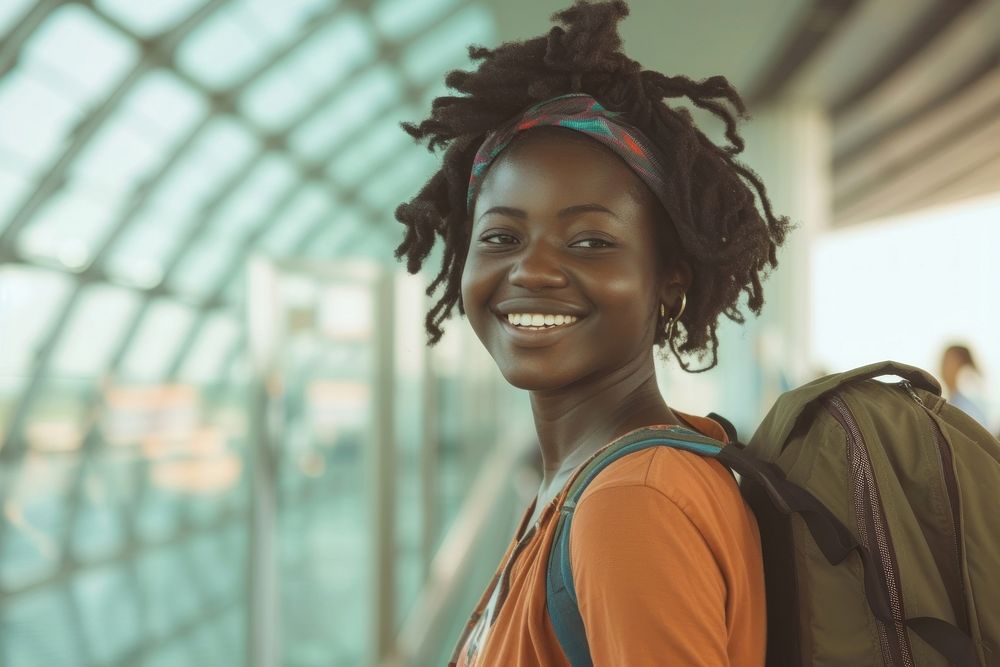 Nigerian girl backpacker at the airport smile happy architecture.