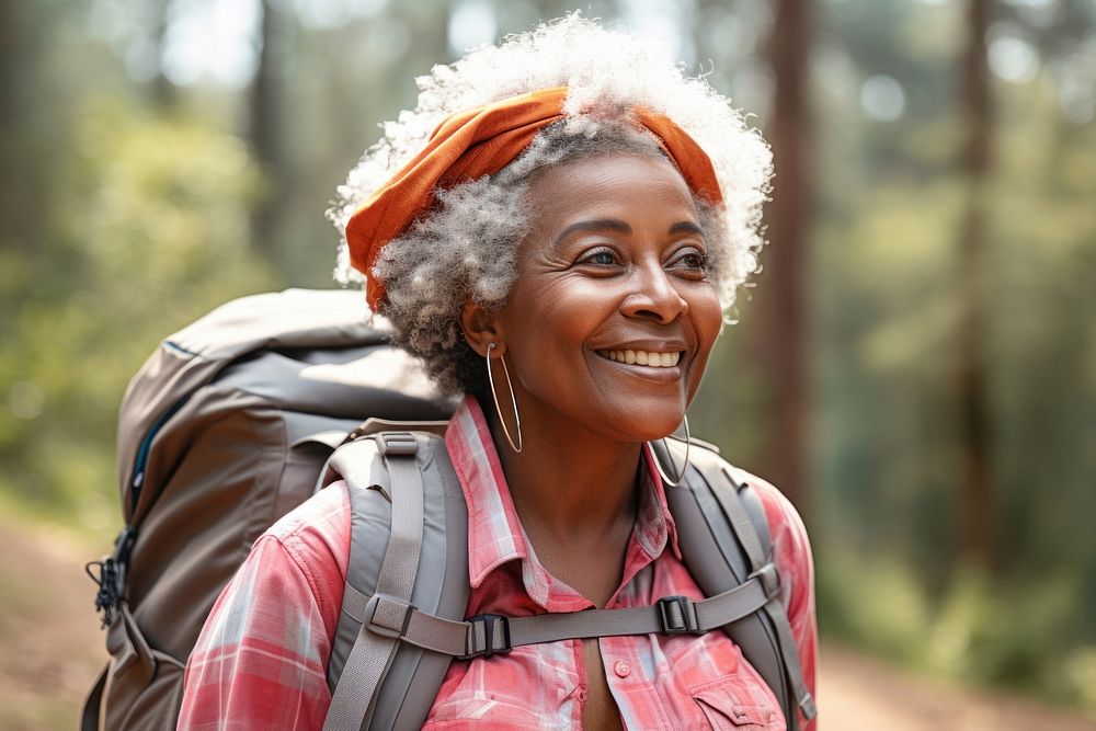 African Senior woman With Backpack portrait backpack forest.
