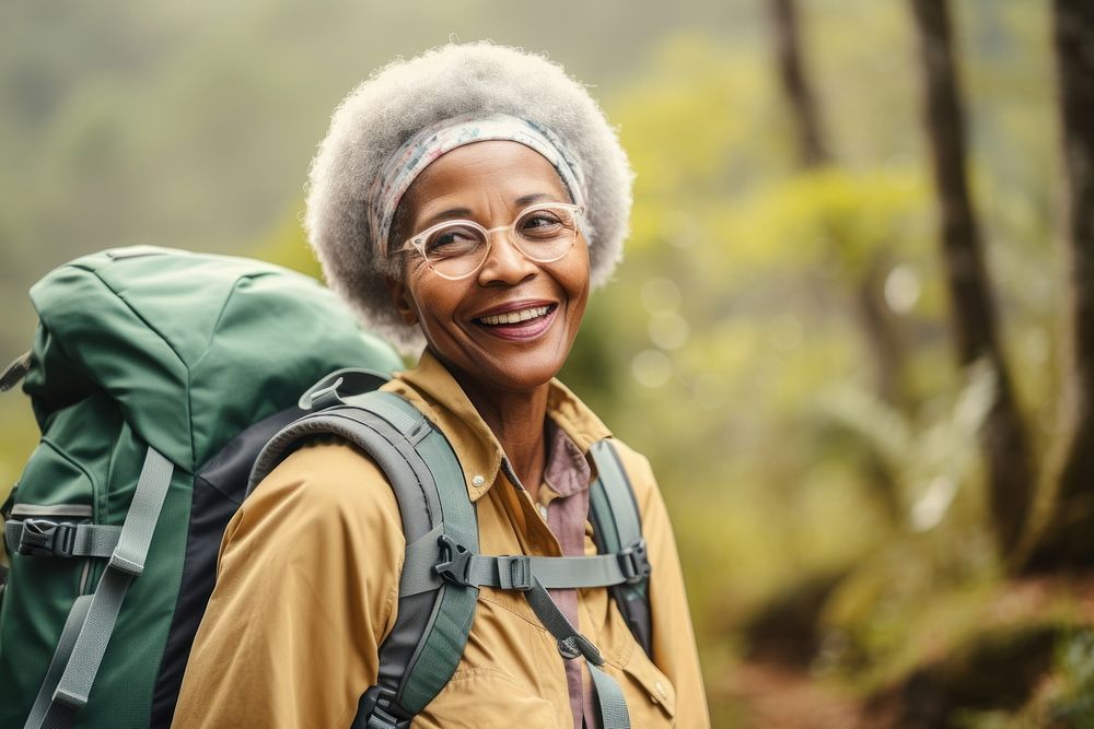 African Senior woman With Backpack backpack portrait forest.