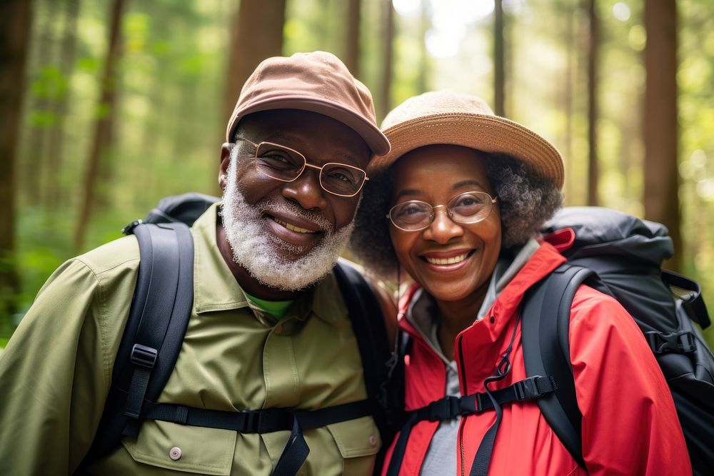 African Senior couple With Backpack backpack adventure portrait.