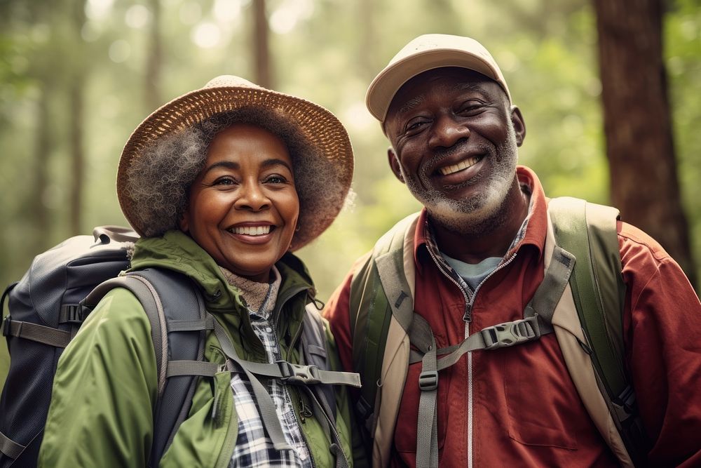 African Senior couple With Backpack portrait outdoors backpack.