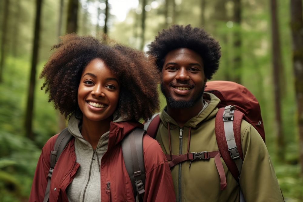 African young couple With Backpack backpack portrait forest.
