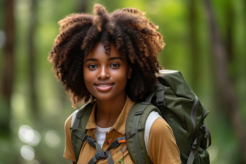African young woman With Backpack portrait forest smile.