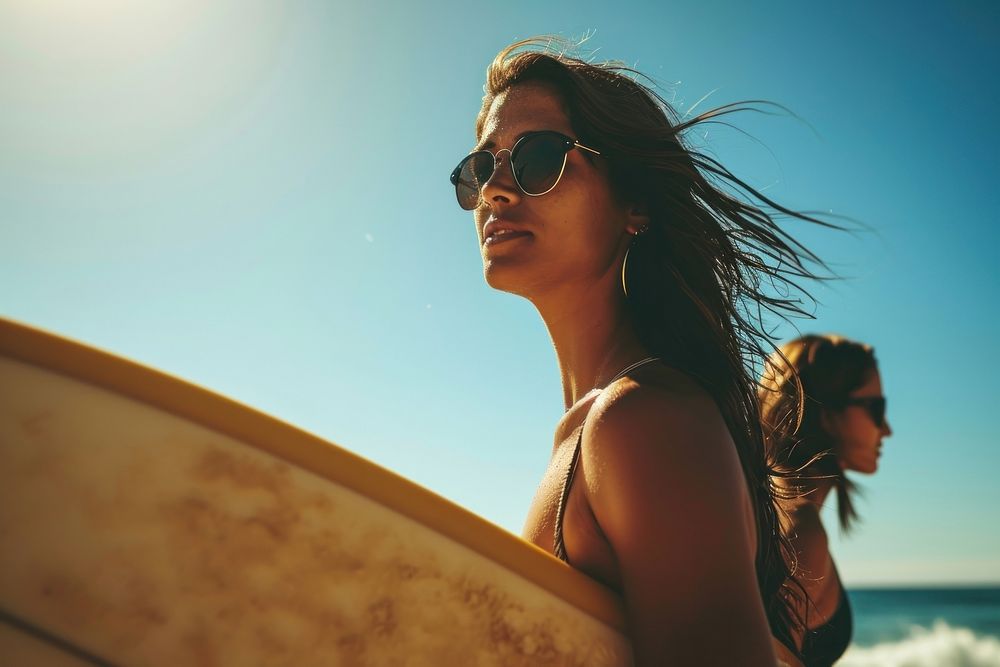 Latina woman carrying surfboard with her friend on the beach sunglasses portrait outdoors. AI generated Image by rawpixel.
