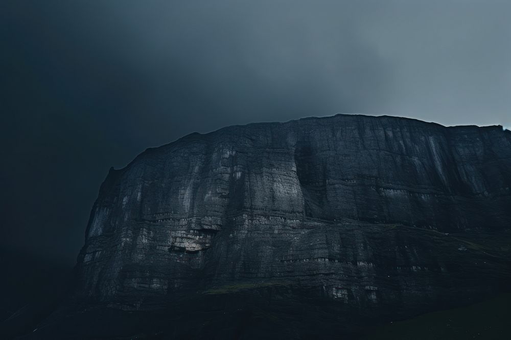 Dark background cliff sky mountain.