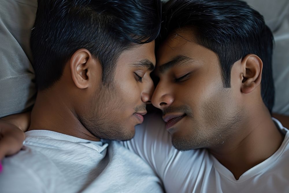 Indian young male couple kissing adult love.