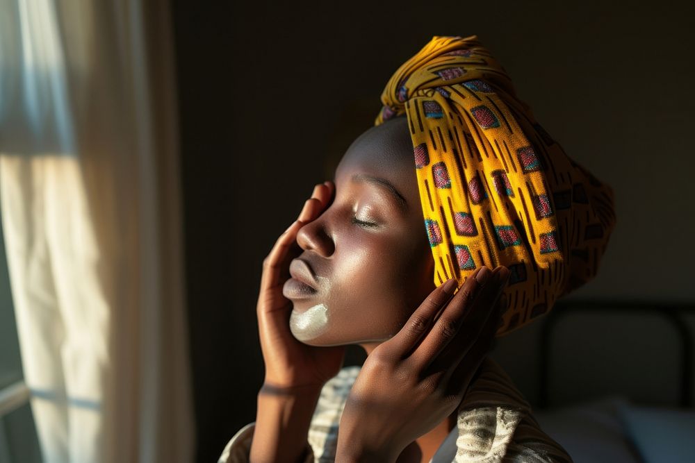 Kenyan woman adult dreadlocks relaxation.
