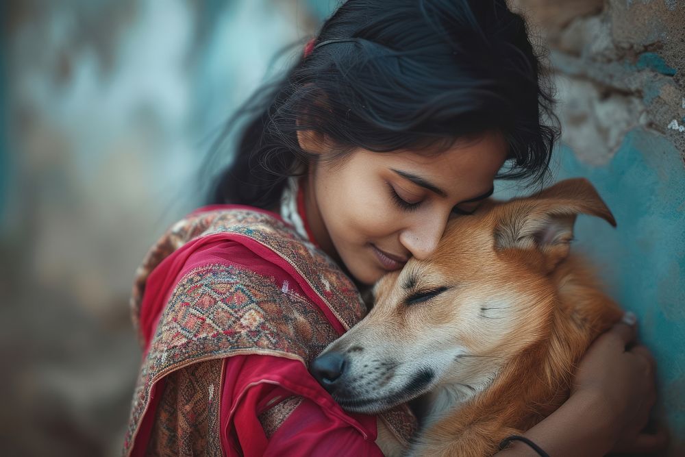 Indian young female hugging a dog portrait mammal animal.