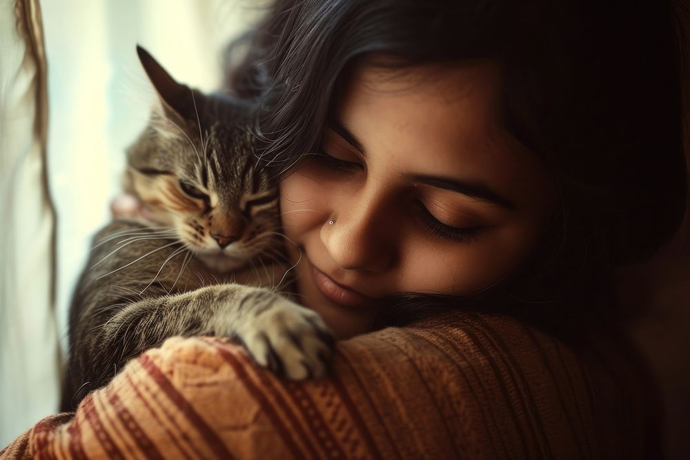 Indian young female hugging a cat portrait animal mammal.