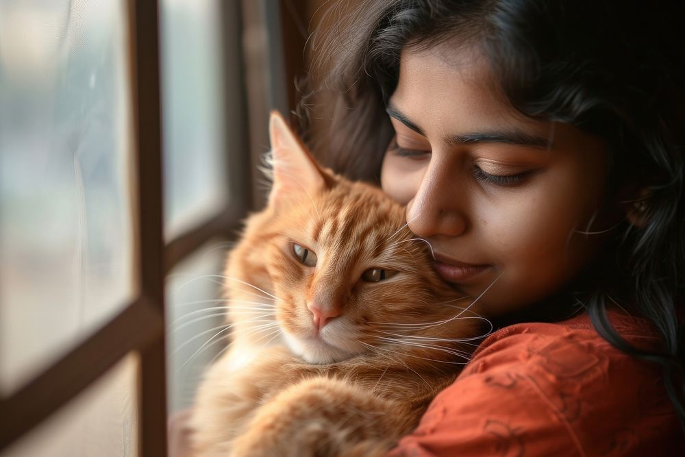 Indian young female hugging a cat portrait animal mammal.