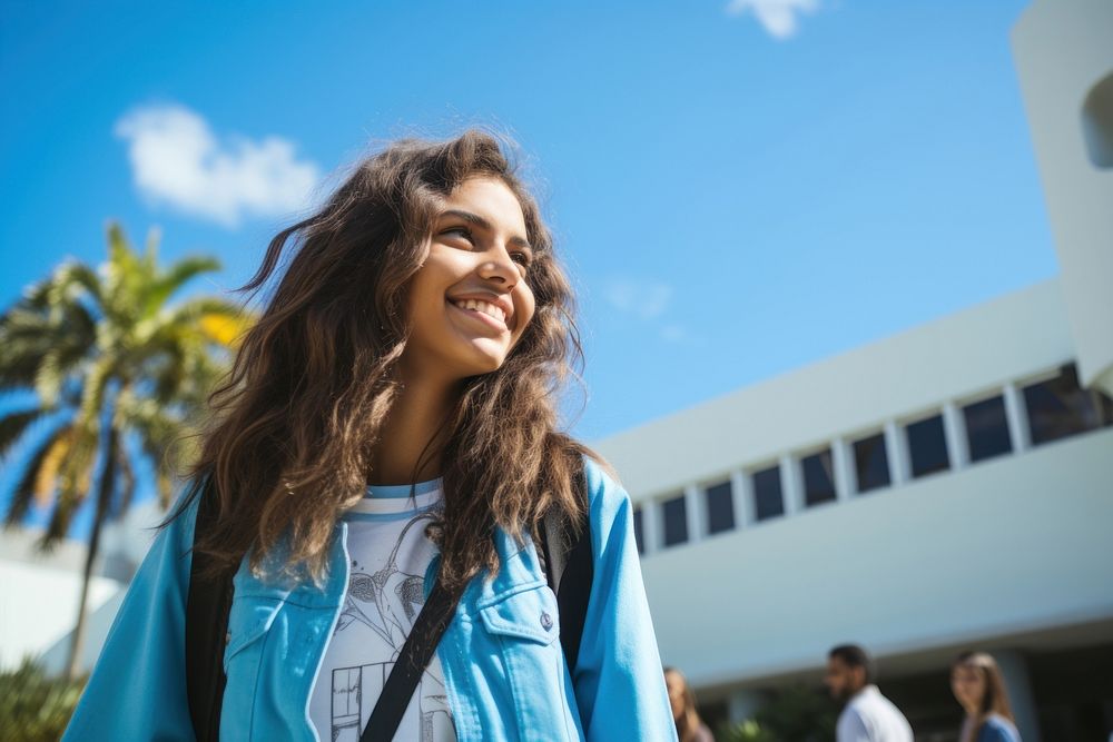 Brazilian student teen smile blue sky.