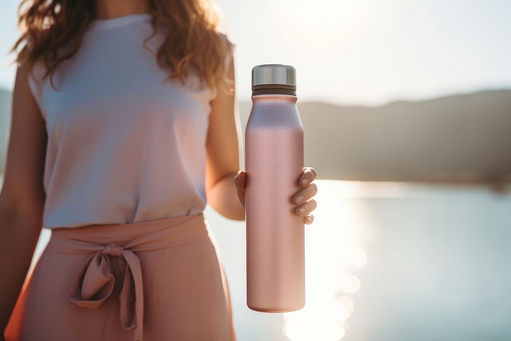 Women holding pastel color metal water bottle adult refreshment container.