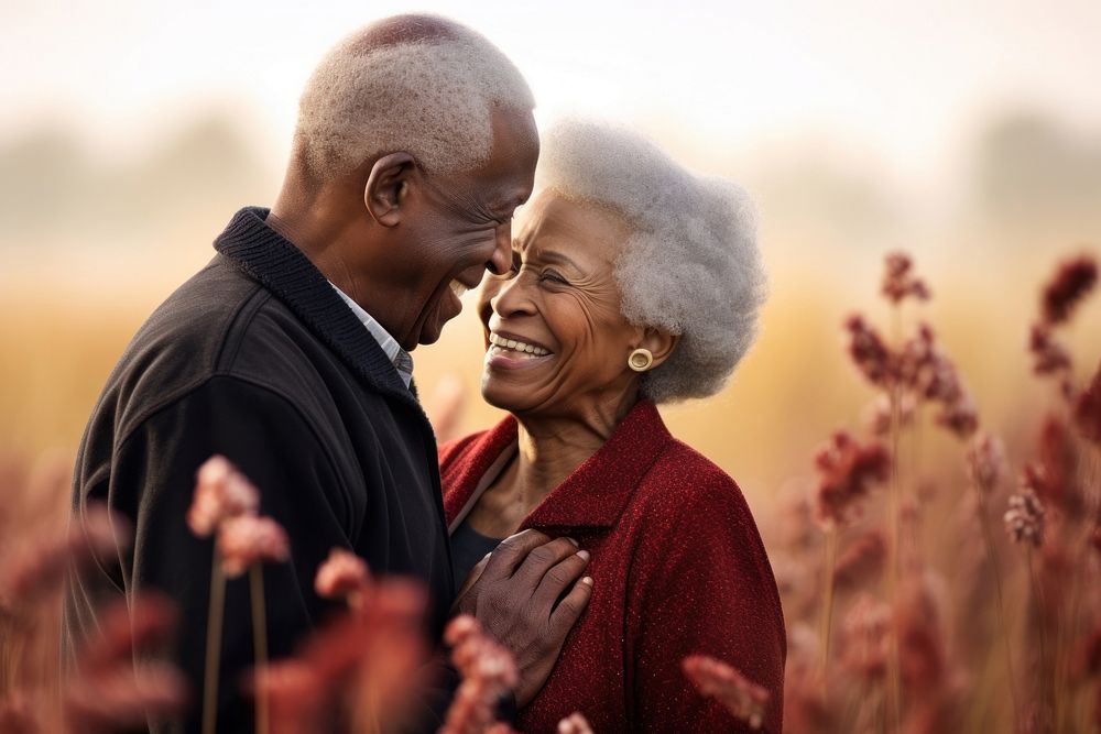 Black senior couple portrait outdoors flower.