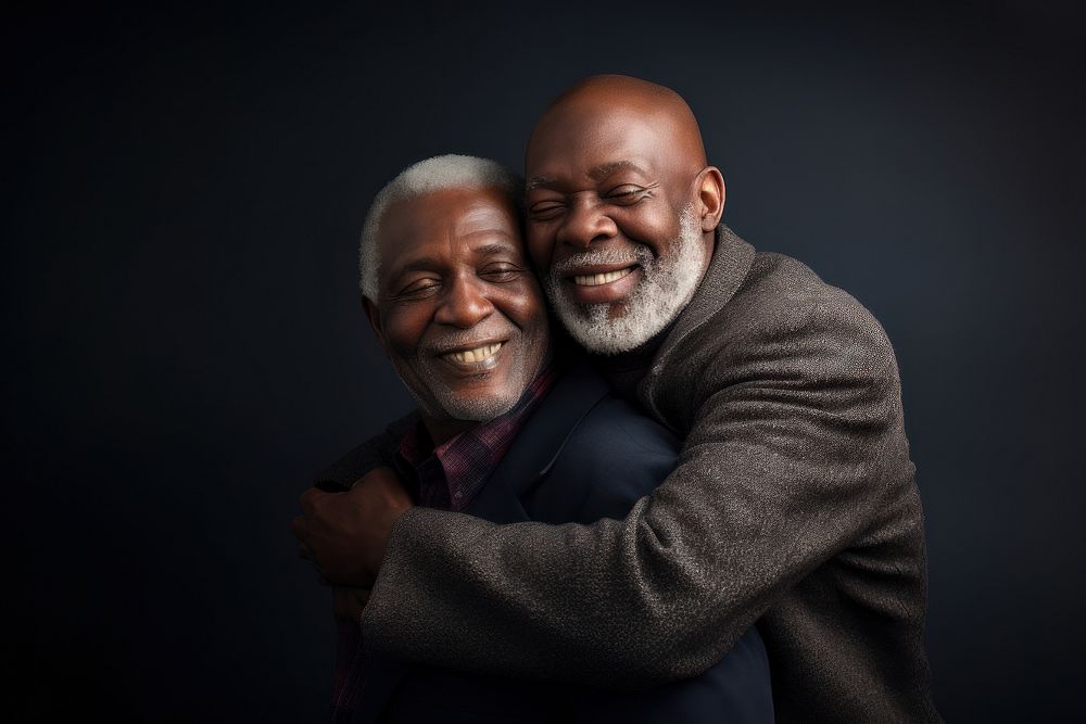 Black senior man and friend hugging portrait adult photo.