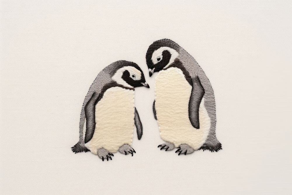 Penguins in embroidery animal bird togetherness.