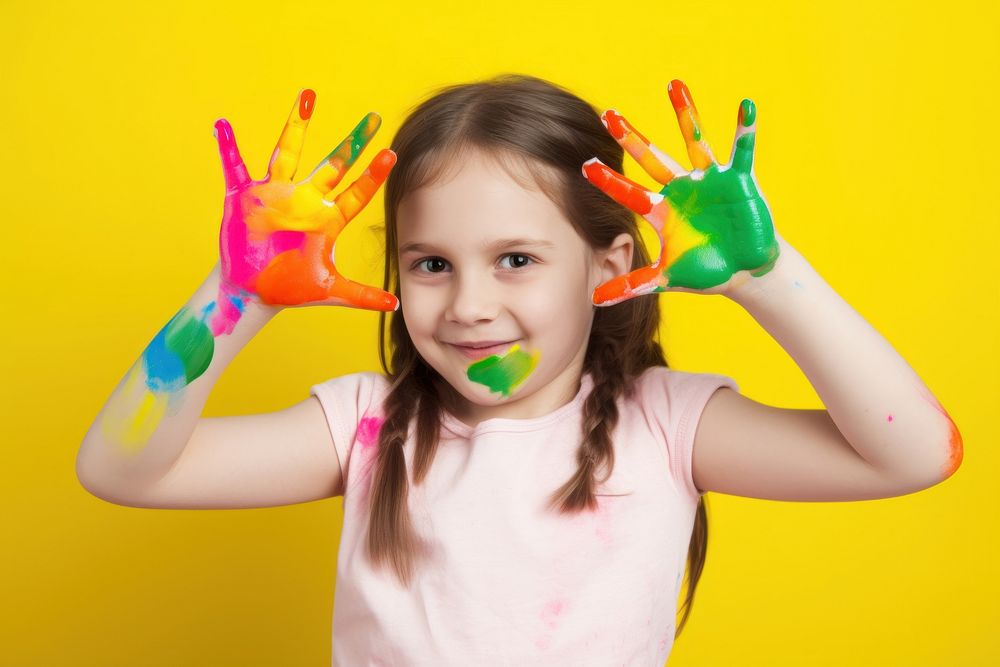 Girl with a hand covered in paint portrait child brush. AI generated Image by rawpixel.