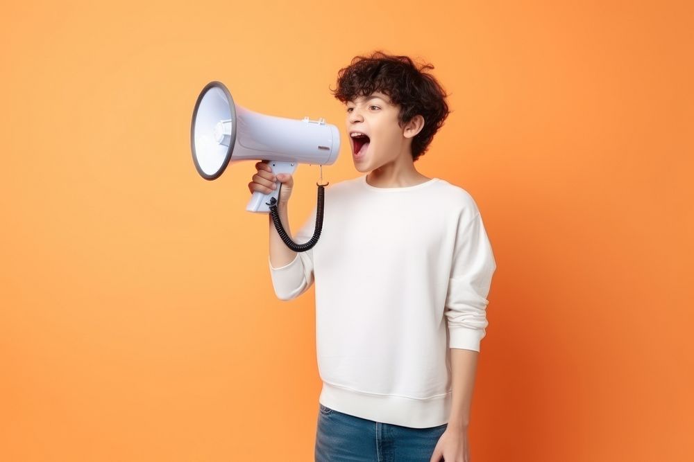 Boy with holding megaphone shouting portrait performance. AI generated Image by rawpixel.