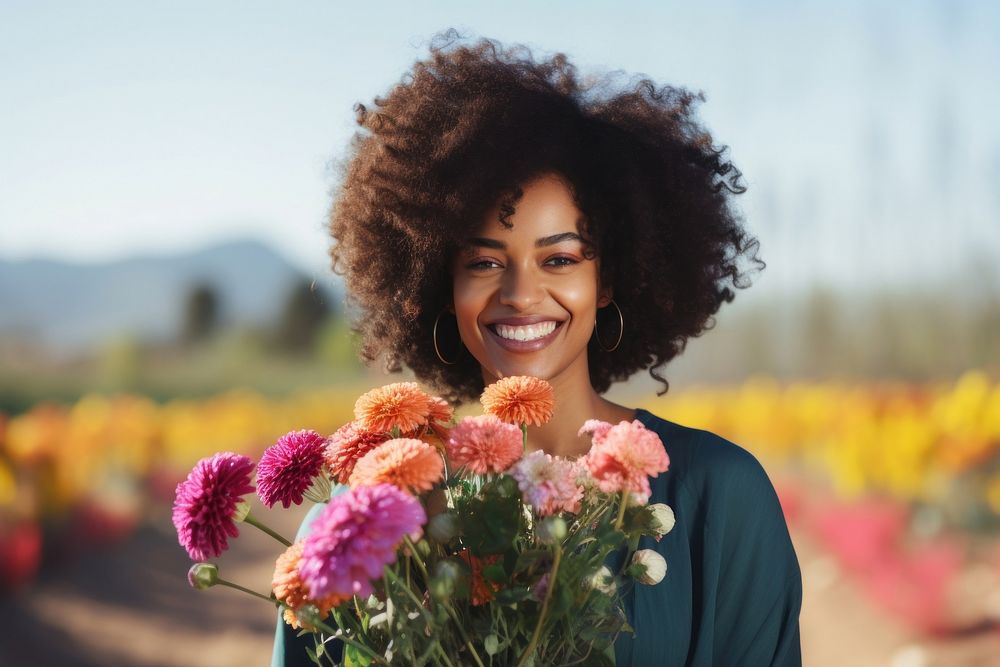 Black woman holding bouquet flower portrait smiling plant.