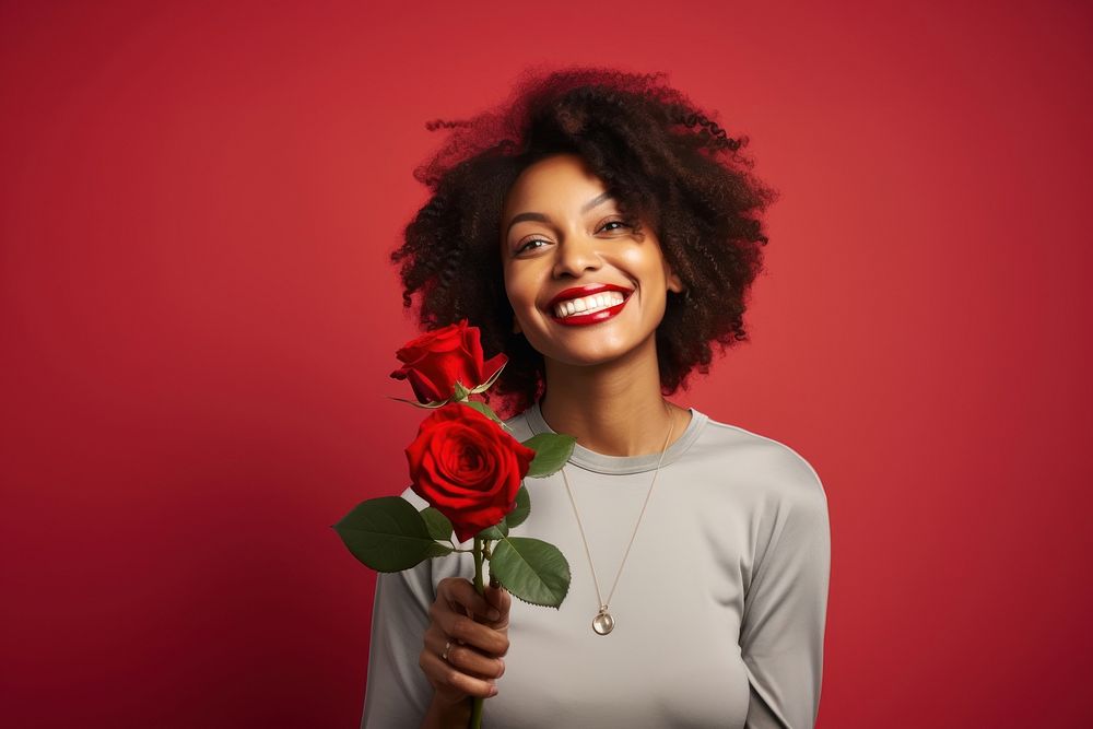 Black woman holding bouquet red rose portrait smiling flower.