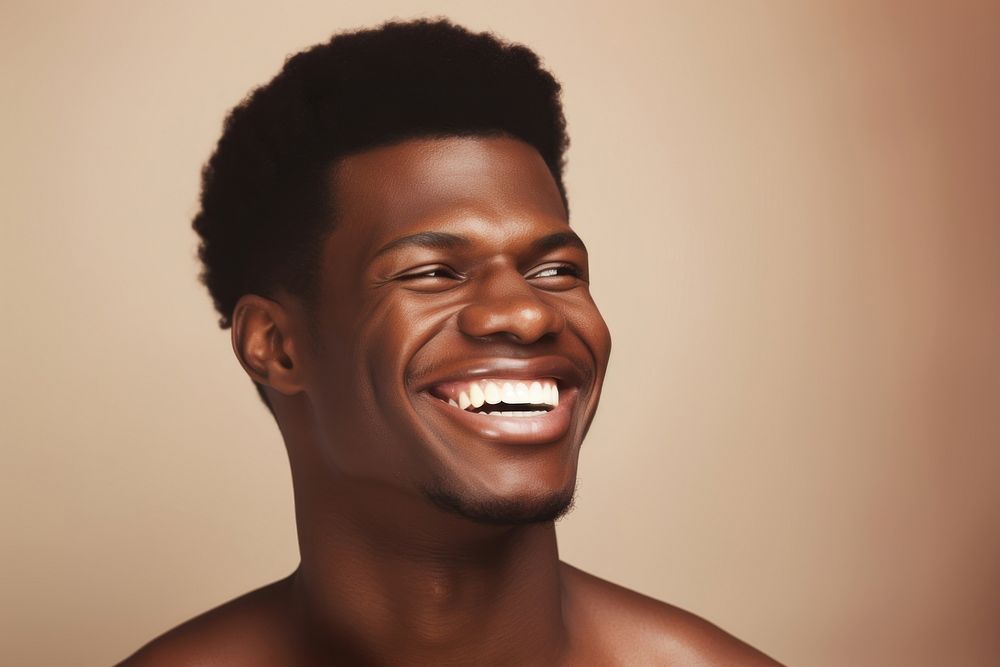 African american man portrait laughing smiling.