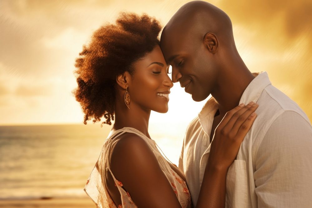 Black couple embracing portrait beach.
