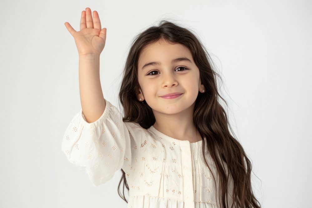 Middle eastern girl 6 years old happy raising her hand portrait child photo.