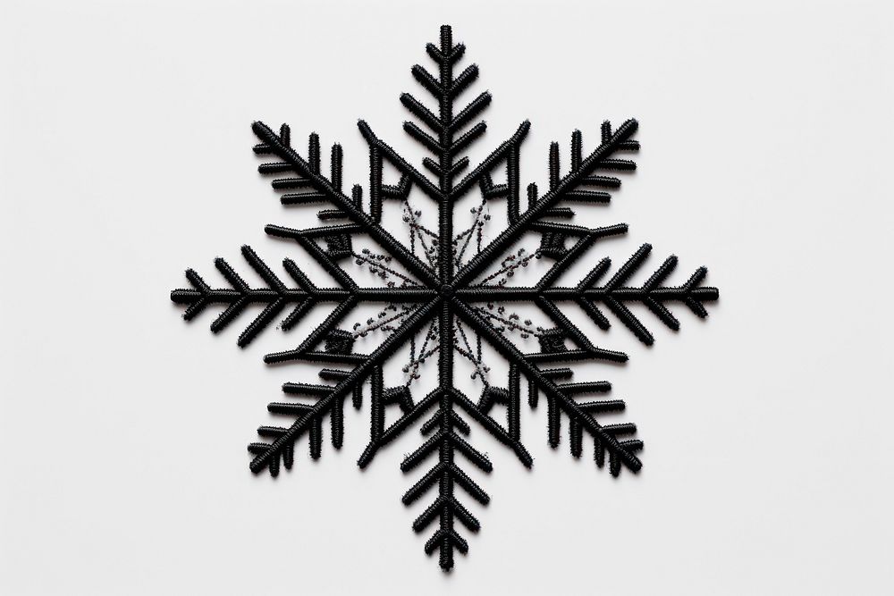 Black snowflake in embroidery style white monochrome christmas.
