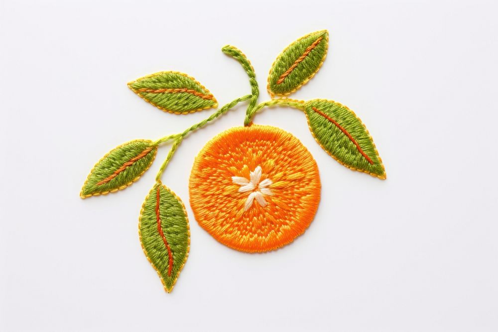Orange fruit in embroidery style textile plant food.