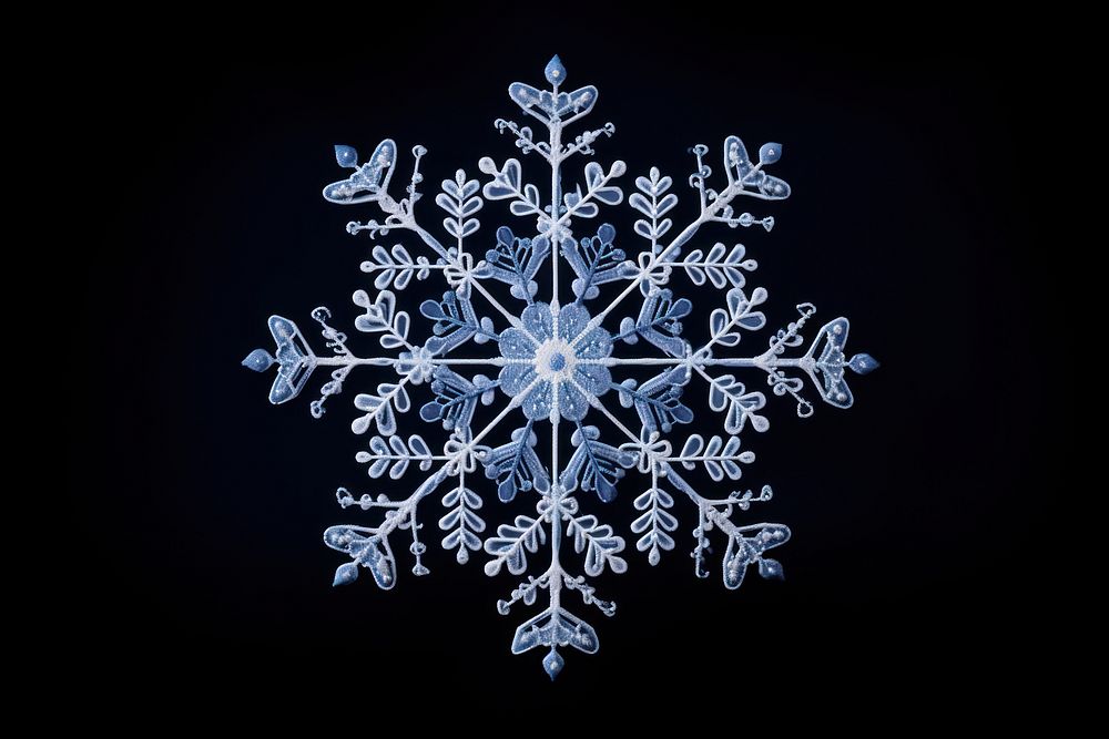 Snowflake in embroidery style white celebration decoration.
