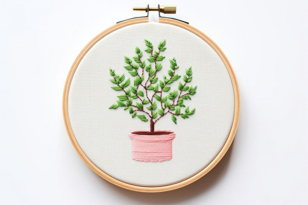 Potted plant in embroidery style needlework textile pattern.