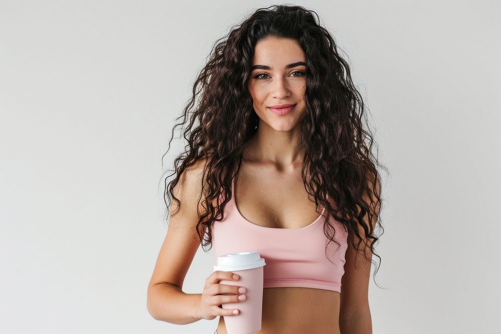 American woman in soft pink top exercise portrait holding photo.