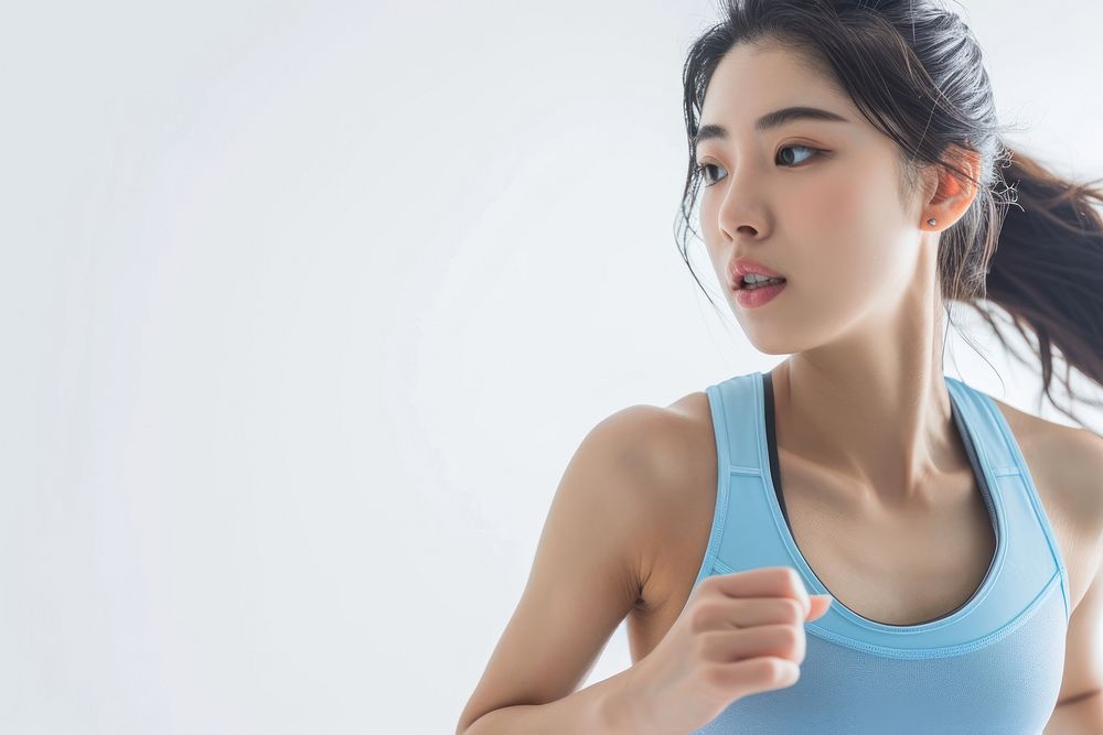 Asian woman in soft blue top exercise adult determination exercising.