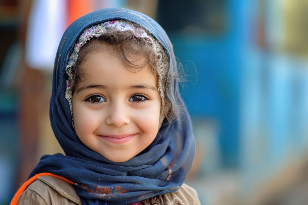 Middle eastern girl portrait scarf smile.