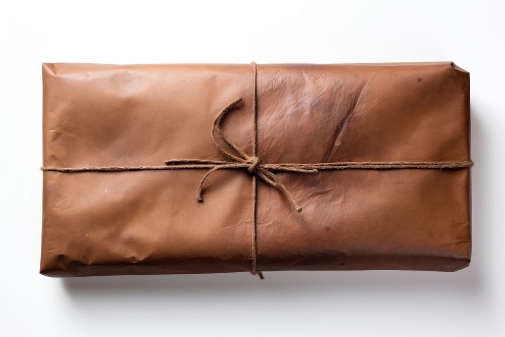 A long Brown wrapped parcel brown bag white background.