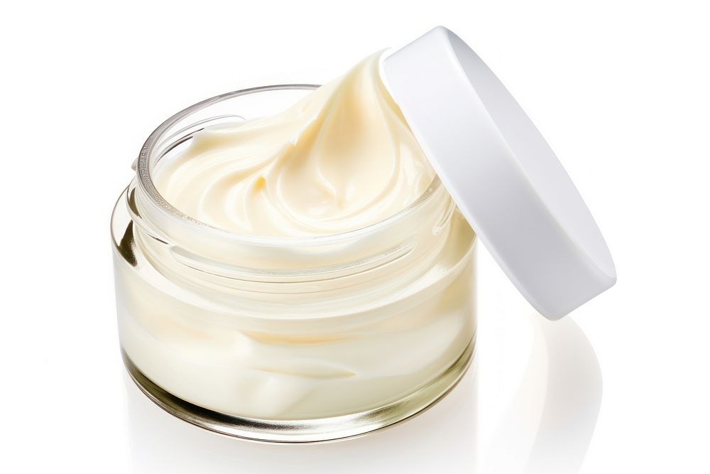Skincare cream jar over smudges of cream dessert white background mayonnaise.