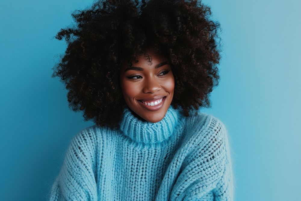 South african woman with a wig and curly hair sweater adult smile.