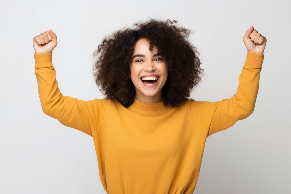 Young cute brazilian woman raise arms laughing adult white background.