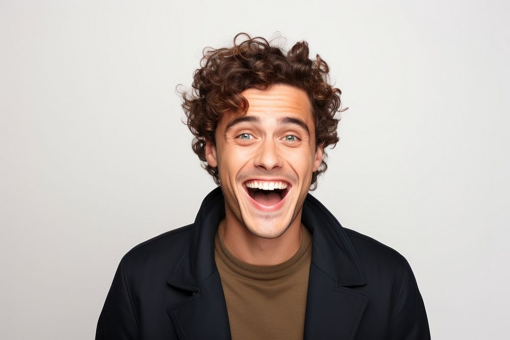 Young caucasian handsome man surprised and smiley shouting portrait adult.