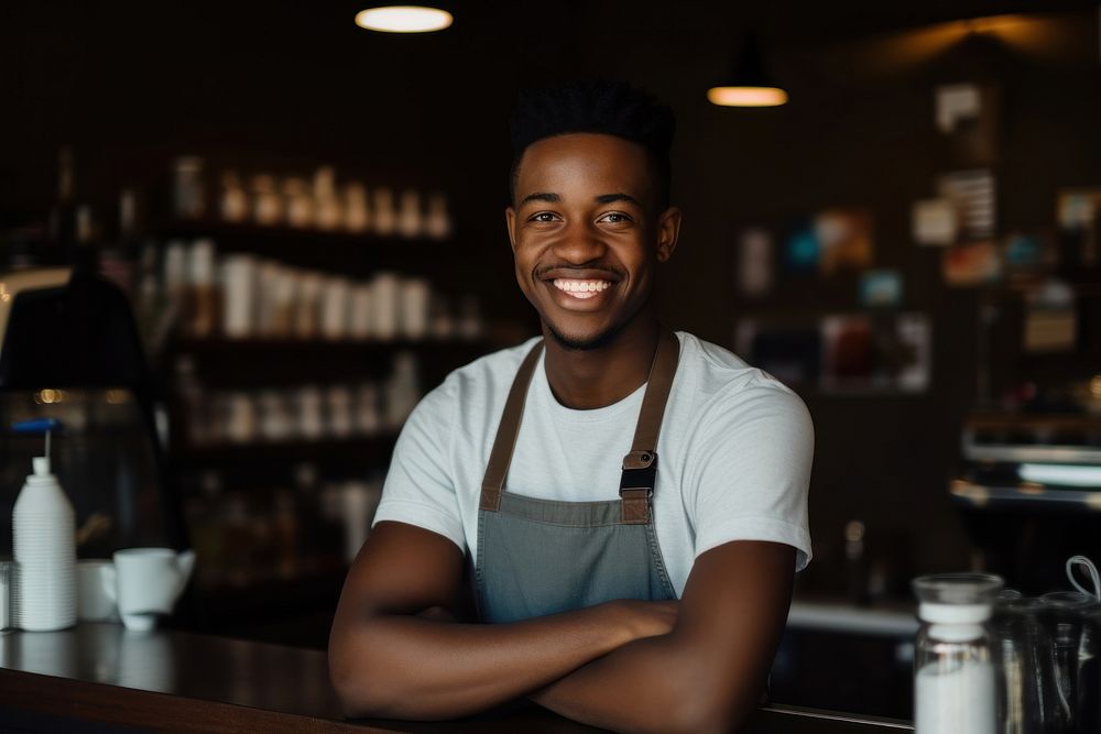 Young African American man smiling waiter cafe.