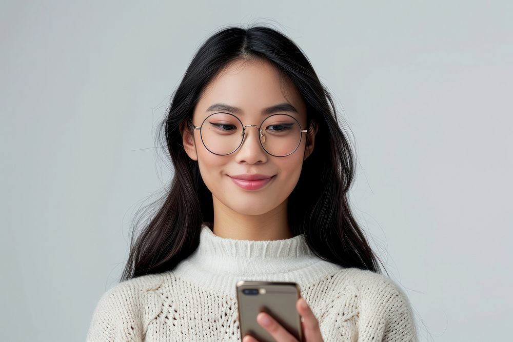 Asian woman in glasses holding a cell phone portrait sweater adult.