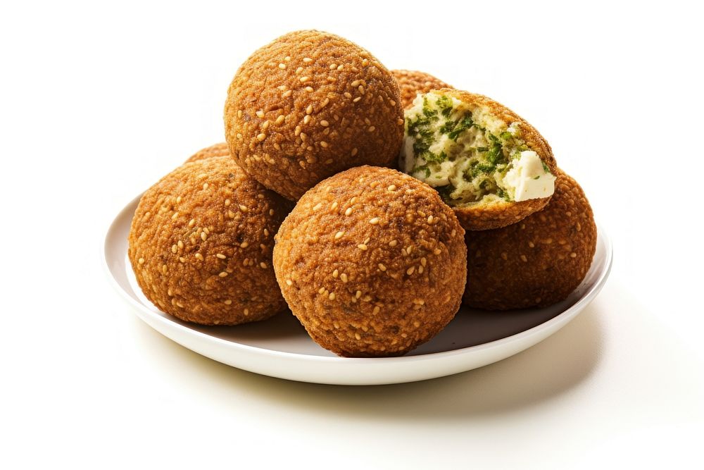 More whole and half falafels bread plate food.