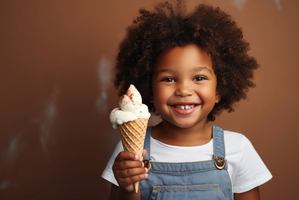 African American little girl food dessert holding.