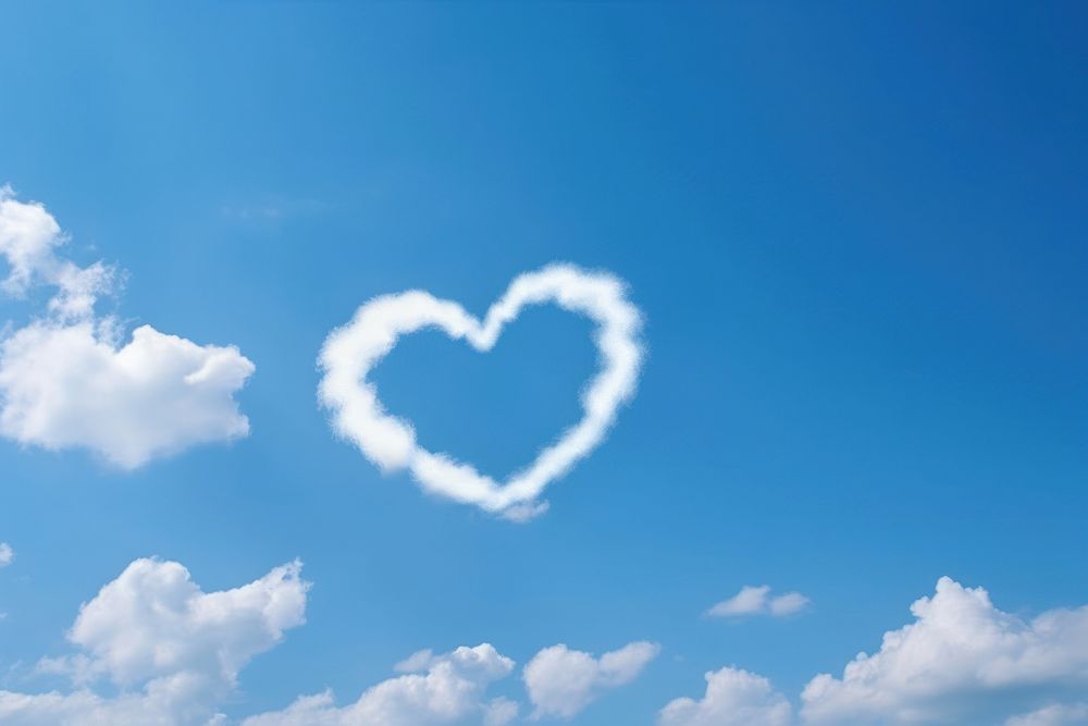 A natural cloud tail in heart shape sky backgrounds outdoors.