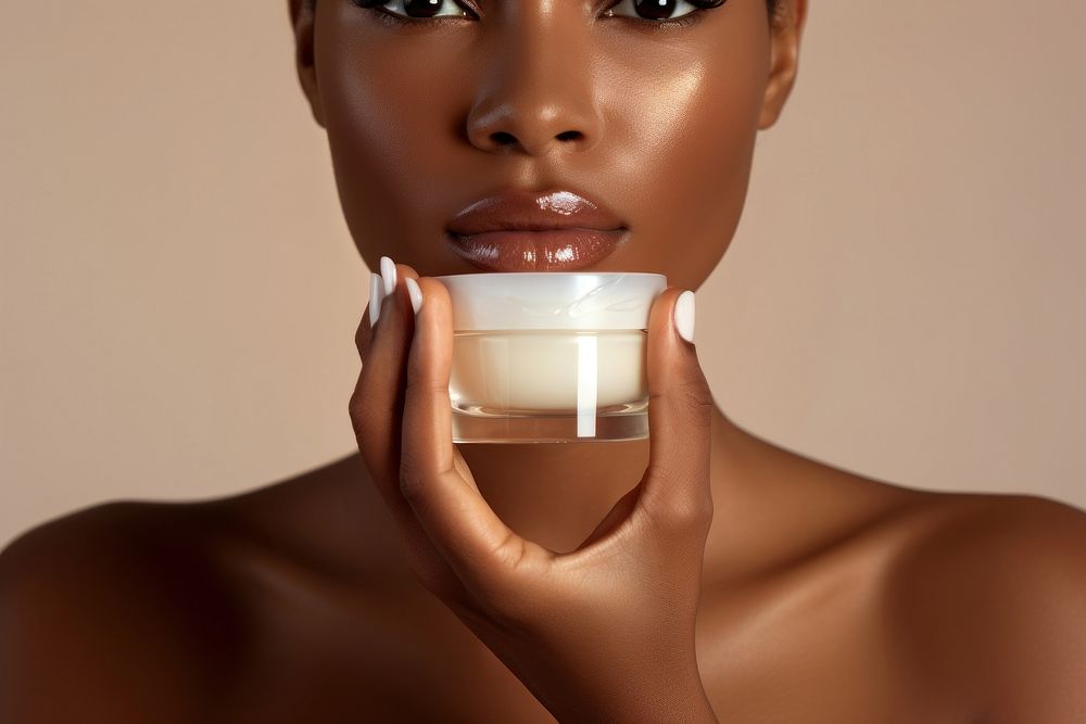 White cream bottle cosmetics hand perfection. AI generated Image by rawpixel.