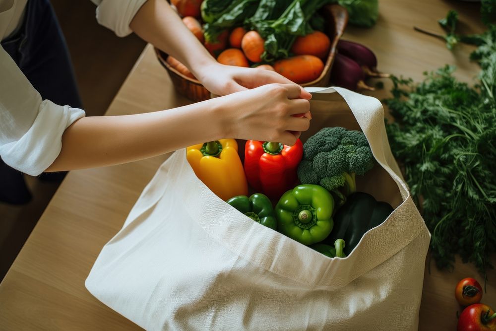 Taking organic vegetables out from tote bag adult food ingredient. AI generated Image by rawpixel.