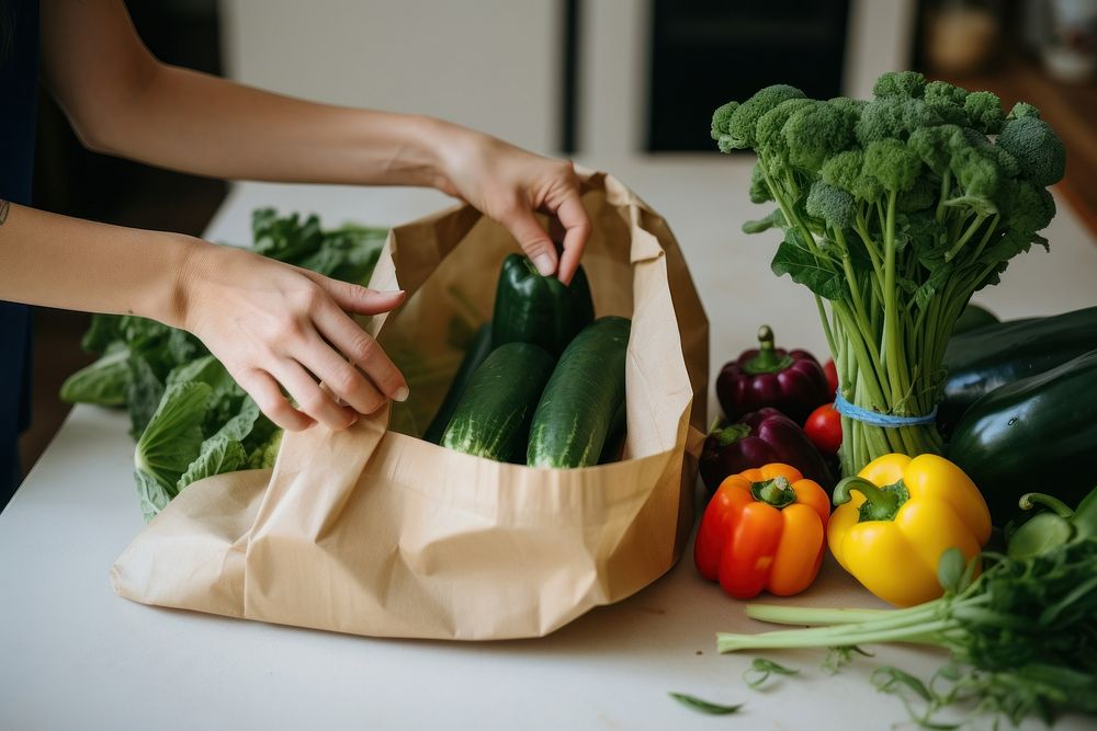 Taking organic vegetables out from tote bag adult plant food. AI generated Image by rawpixel.