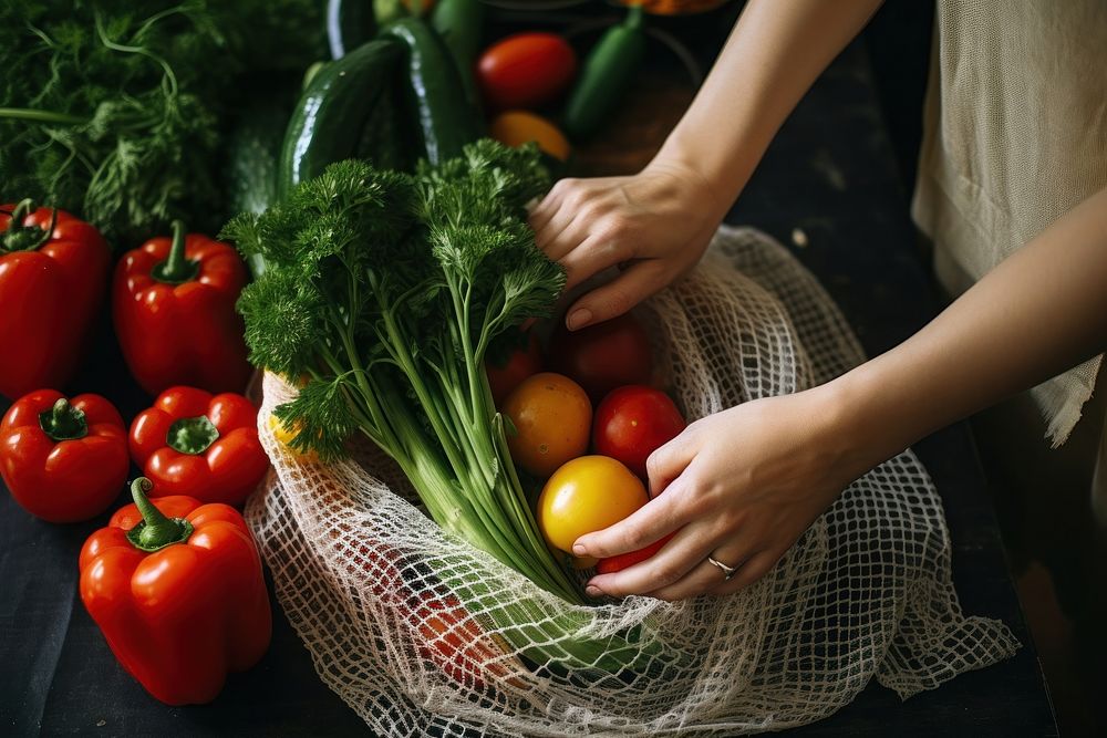 Taking organic vegetables out from net bag kitchen plant food. 