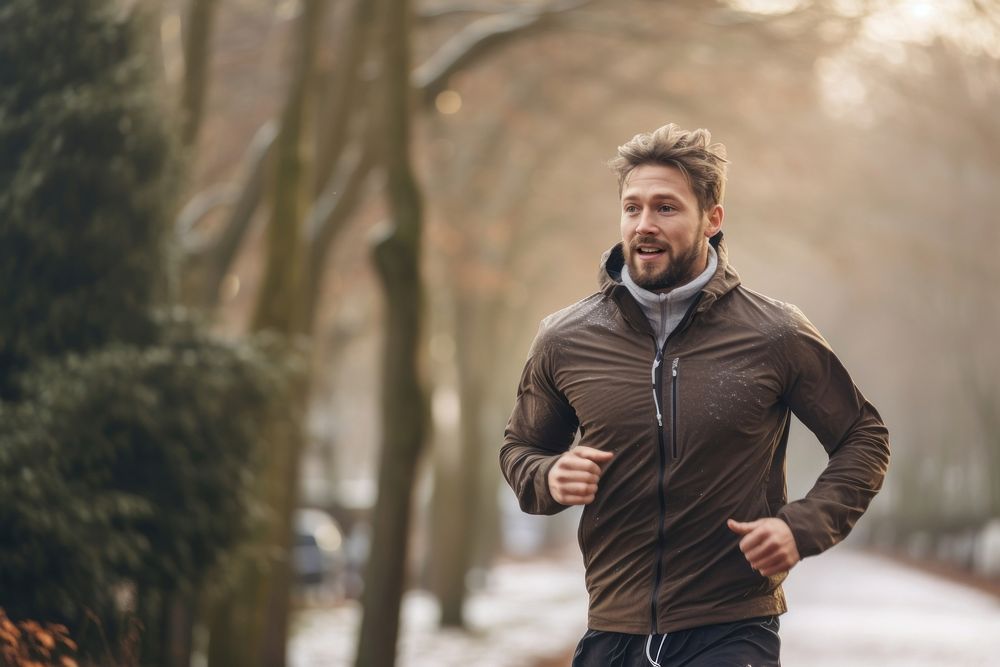 Man running jogging jacket winter. AI generated Image by rawpixel.