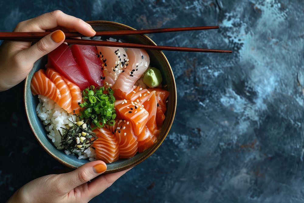 Sashimi Rice Bowl chopsticks holding food. AI generated Image by rawpixel.