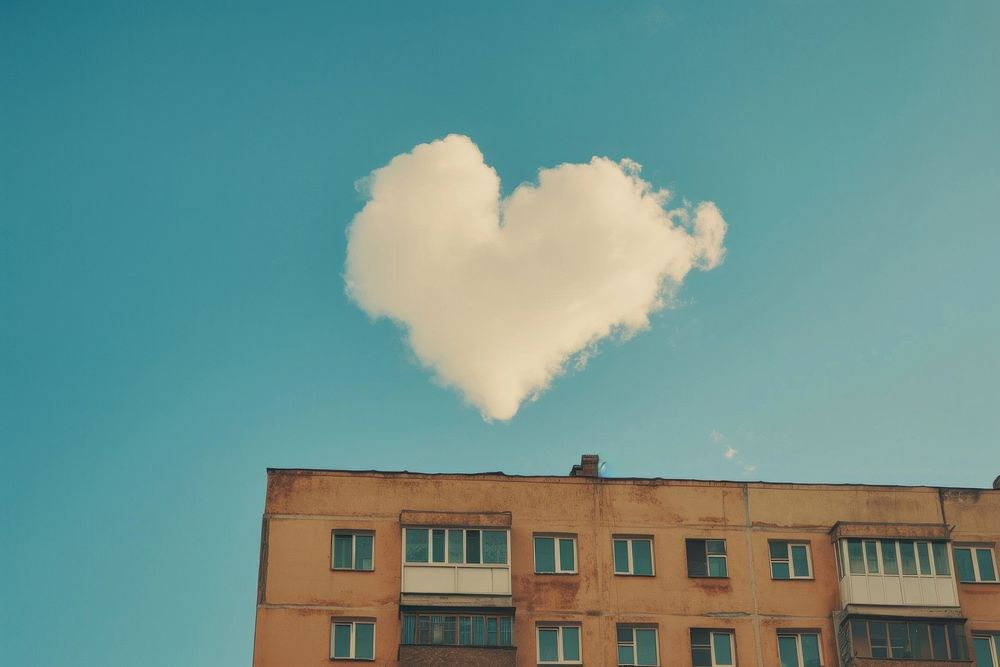 Heart shaped clouds in the sky over the building architecture outdoors window.